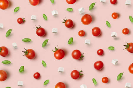 Juicy fresh organic tomatoes pattern with cheese and basil.の写真素材