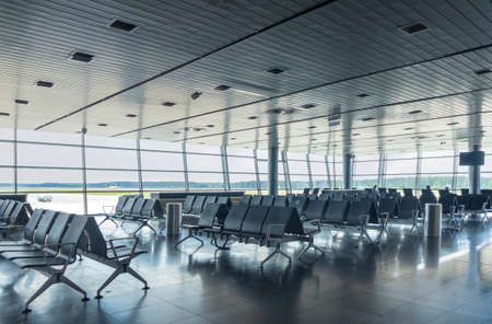 Waiting hall in the airport with empty arm-chairs.の写真素材