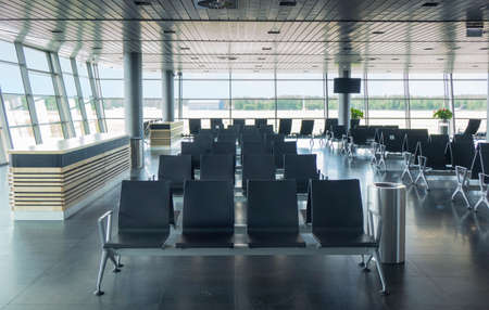 Empty waiting hall in airport with lounge area.の写真素材