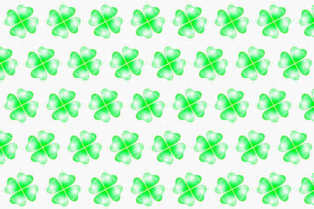 Creative green pattern from drink splashes in the shape of shamrock's petal with droplets on a white...