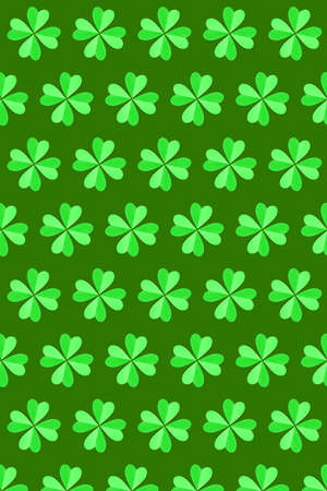 Handcraft clover's green plants pattern with four petals made from paper on a green background. Happy St.Patrick 's Day concept.の写真素材
