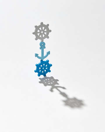 Vertical stand from plastic anchor and wheels with shadows.の写真素材