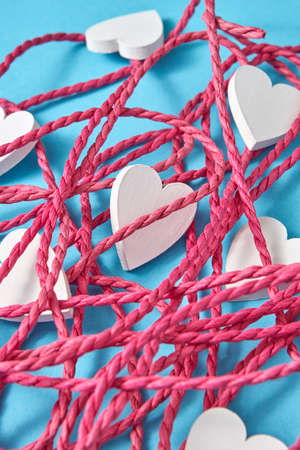 Close-up background from red rope and white hearts.の写真素材