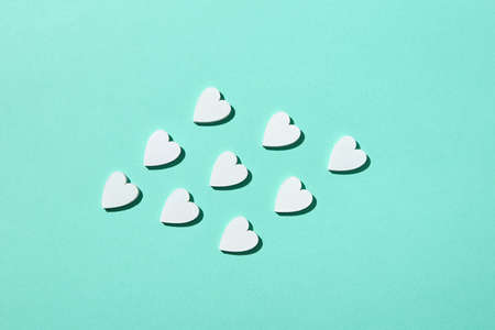 Handmade paper hearts pattern with hard shadows.の写真素材
