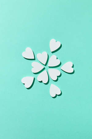 Valentines flowers pattern made from small hearts with shadows.の写真素材
