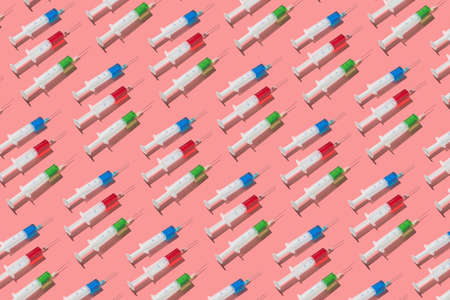 Therapeutic pattern of plastic syrenges with colorful vaccines.の写真素材