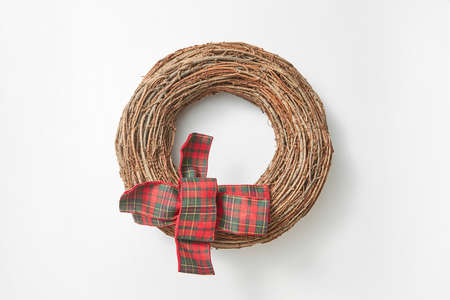 Handcraft round wreath from twigs on a white background.の写真素材