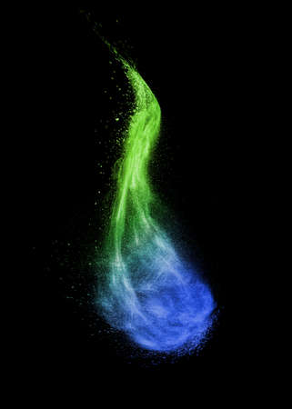 Vertical wave as a colorful powder explosion on a black background.の写真素材