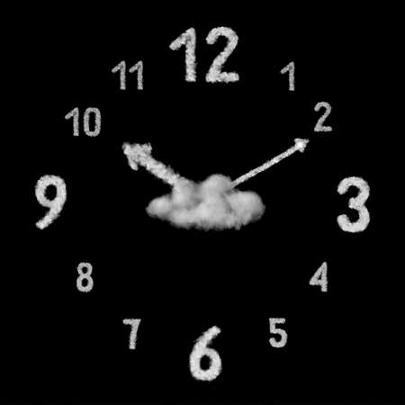 Close up view of big creative clock made from white clouds or smoke on a black background with copy space.の写真素材