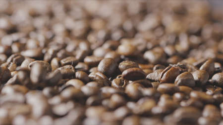 Closeup of splashing falling fragrant roasted coffee beans. Slow motion, Full HD video, 240fps,...