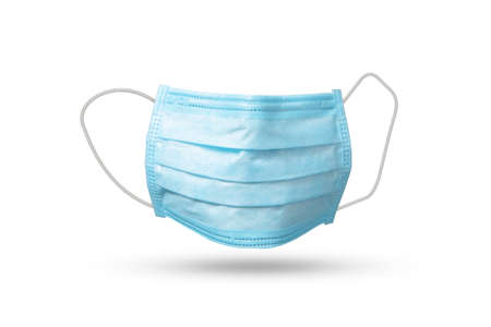 Flying medical mask above white background with soft shadows.の写真素材