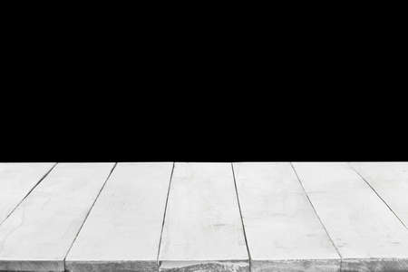 Empty white wooden boards or desktop against black background. Template and mockup for display or montage of your products. Close up, copy spaceの写真素材