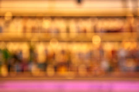 Blurred creative background of restaurant bar with pink desk space.