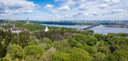 Aerial panoramic view of botanical garden, statue and churchesの写真素材