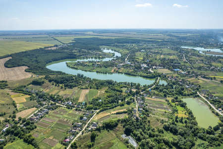 Aerial view of town with river and natureの写真素材