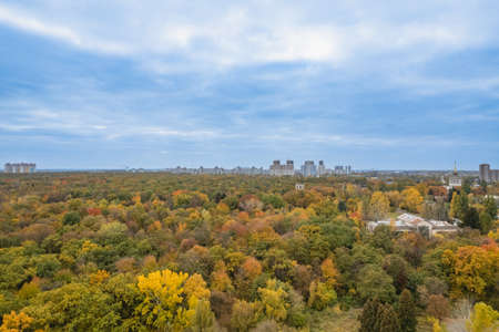 Aerial view of modern city with autumn parkの写真素材
