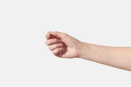 Gesturing female hand isolated on whiteの写真素材