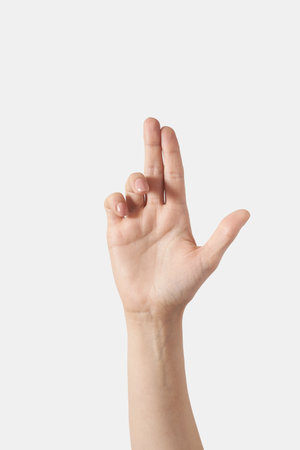 Female hand pistole up isolated on whiteの写真素材