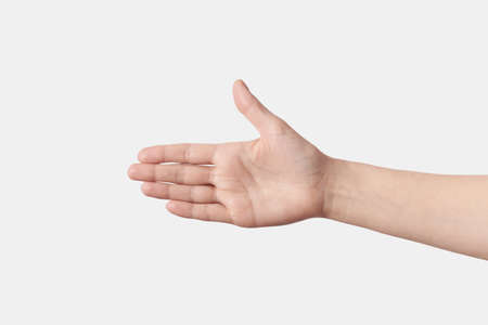 Close up handshake reaching female hand on white.の写真素材