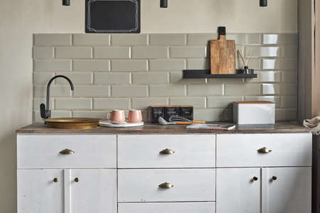 Elegant small kitchen with sink and counter at country house.の写真素材