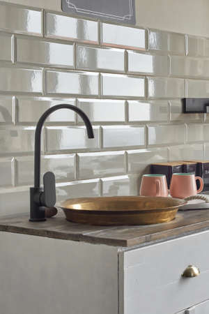Copper sink on elegant kitchen counter at country house.の写真素材