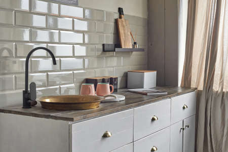 Comfortable elegant kitchen counter with sink at country house.の写真素材