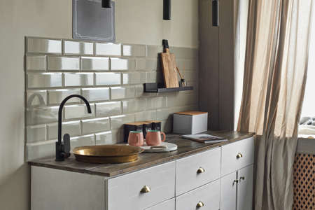 Elegant small kitchen with sink and counter at country house.の写真素材