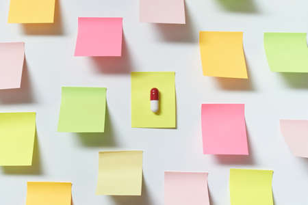 Pharmaceutical pill on sticky note.の写真素材