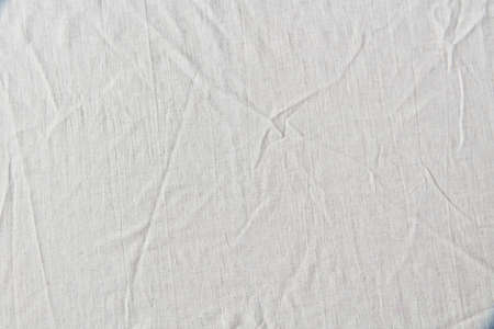 White crumpled linen cloth background.の写真素材