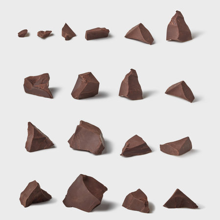 Chunks of dark chocolate isolated on white background. Set for branding design.の写真素材
