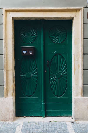 Green wooden old door in Rome, Italyの写真素材