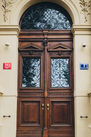 Wooden old door with windows in Pragueの写真素材