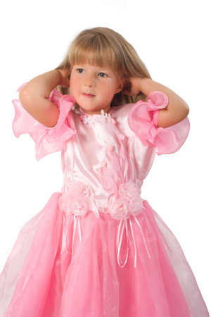Portrait of little girl in pink dress. Isolated on white backgroundの写真素材