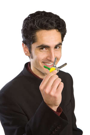 Portrait of handsome  man with keys. Isolated on white background.の写真素材