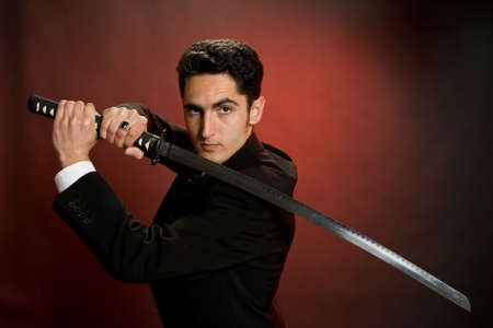 Portrait of handsome  man with sword.の写真素材