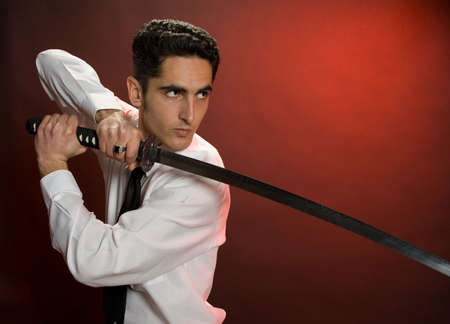 Portrait of handsome  man with sword.