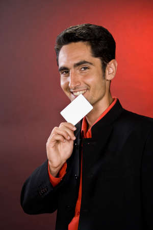Successful businessman with plastic card. 