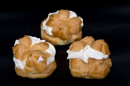 Cakes isolated on black backgroundの写真素材