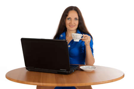 Portrait of young girl is working on laptop.の写真素材