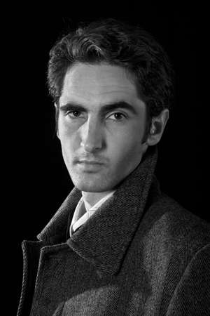 Portrait of handsome man on black background.の写真素材