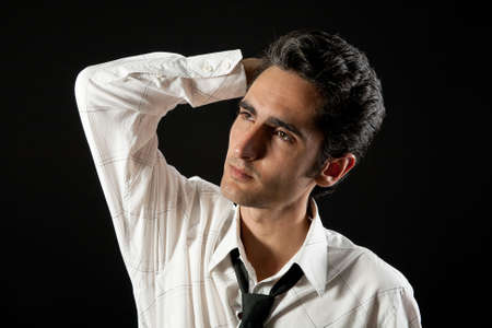 Portrait of handsome man on black background.の写真素材