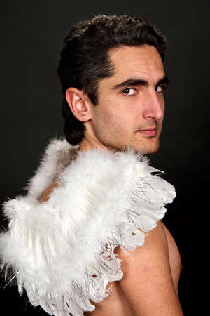 Portrait of glamour man with white wingsの写真素材
