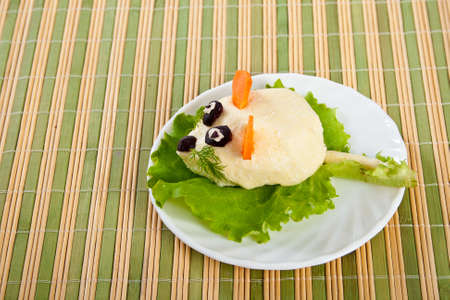 Carving from lettuce and cheese with egg snack in form mouseの写真素材