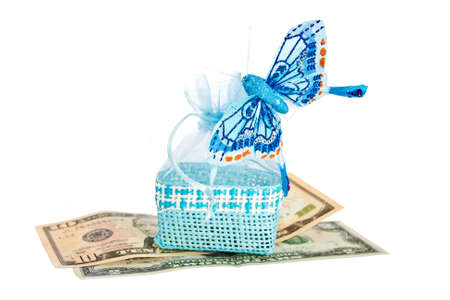 Blue straw paper-bag with money and butterfly  Isolated on white background の写真素材