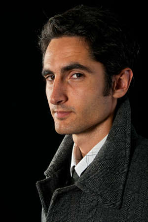 Portrait of handsome man on black background.の写真素材