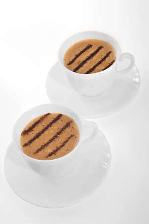 Cup of coffee with decoration in form by chocolate lines の写真素材