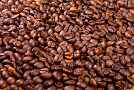Beans of black arabic coffee on the table.の写真素材