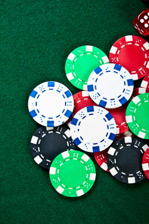 Group of chips on the green cloth の写真素材