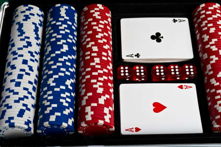 Set of chips; dices and cards for the poker in suitcase. 
