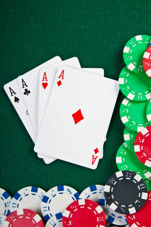 Chips and cards for the poker on the table  の写真素材